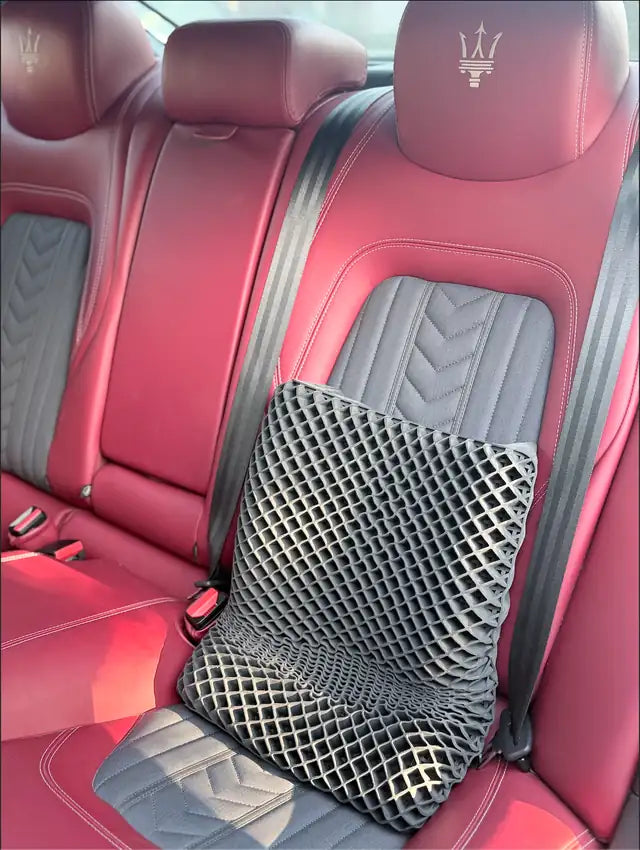 Boo's Dream Pillow used as back support in a car